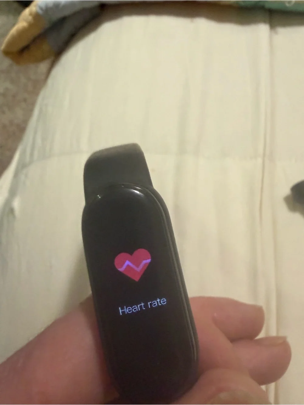 black Xiaomi Mi Band fitness tracker, model 6 or similar,